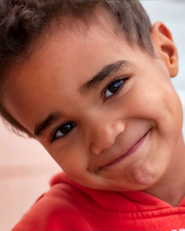 Smiling boy in a red shirt