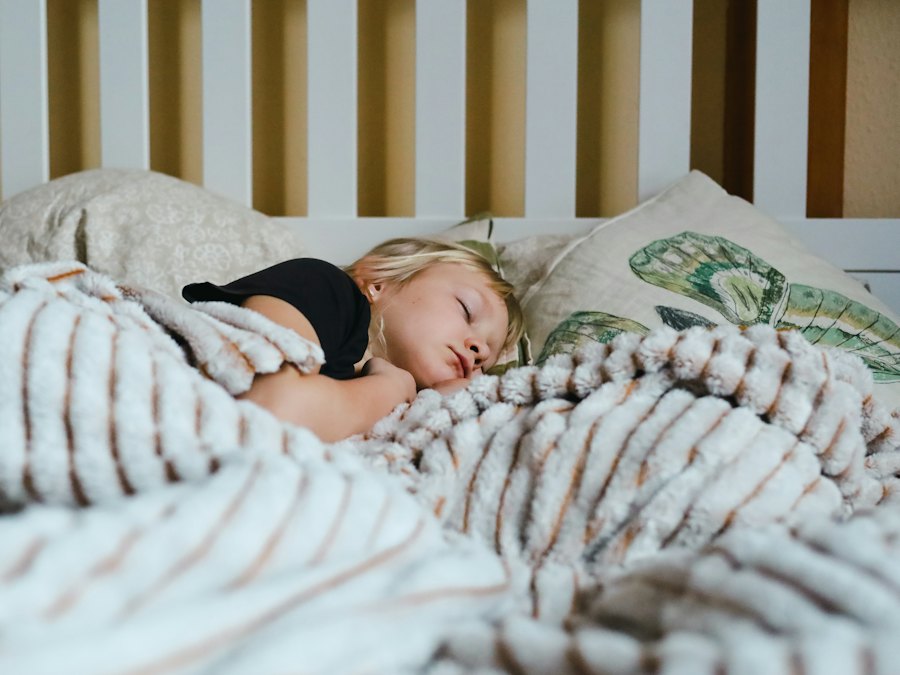Child sleeping peacefully under a blanket